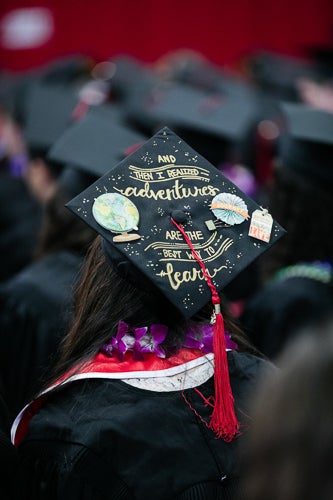 Photo of a cap that says: "and then I realized adventures are the best way to learn"
