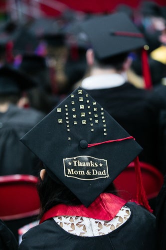 Photo of a cap that says "thanks mom & dad"