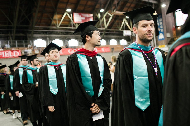 Photo of graduates walking into the ceremony