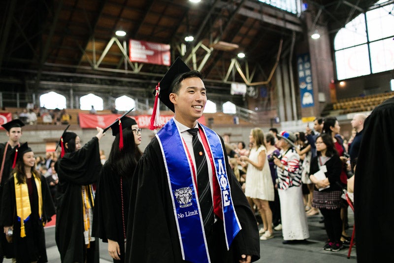 Photo of a graduate walking in