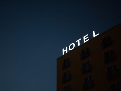 hotel sign lit up at night on building
