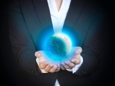 Globe in the hands of a businesswoman
