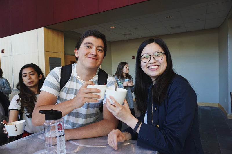 Photo of students toasting with their ice cream