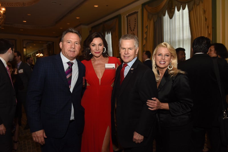 Photo of four people in the banquet hall