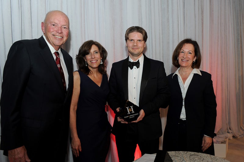 Photo of two men, a woman, and Dean Walsh