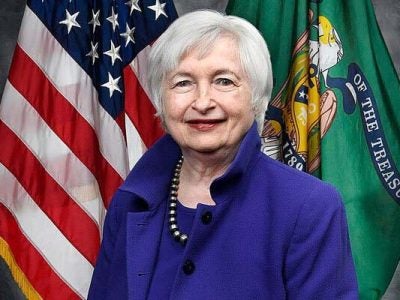 Portrait of Janet Yellen, 78th United States Secretary of the Treasury, in front of the American flag,