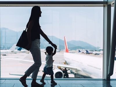 A woman and child hurry