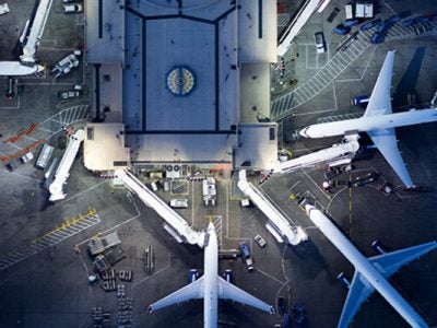 Image of an planes at an aurport terminal.