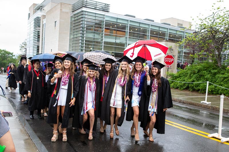 Photo of female graduates walking to the stadium