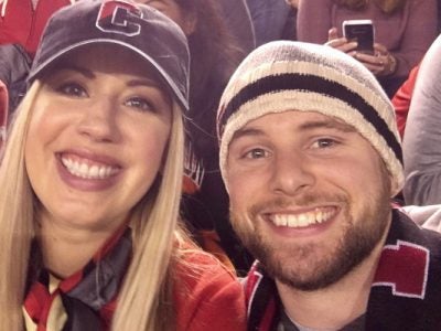 Photo of Nick and Katie Meyer wearing Cornell clothing
