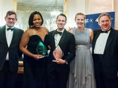 Symone and Harrison stand with their awards