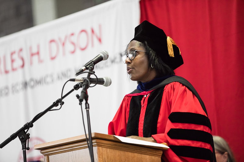 Lynn Perry Wooten speaking at the podium 