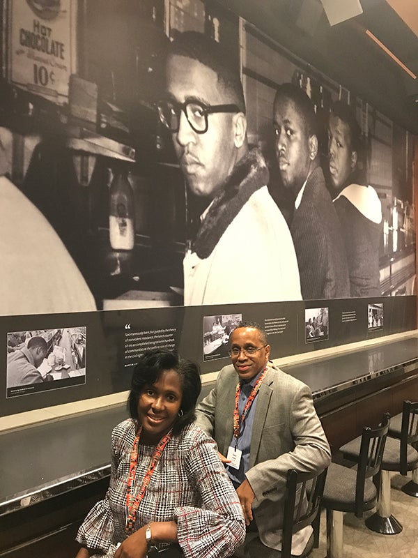Photo of Lynn and David Wooten at the Woolworth&rsquo;s Lunch Counter exhibit featuring photos of African Americans