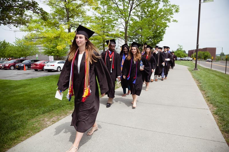 Photo of Maddie leading the procession