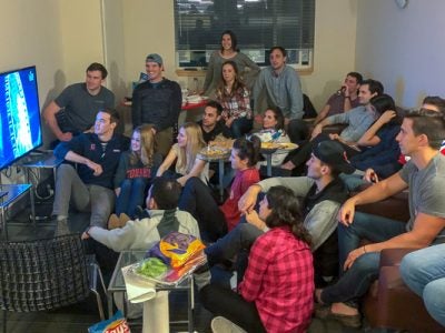 A large group of students watching TV