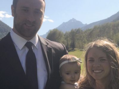 Photo of Max and his family standing outside