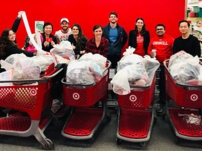 People standing with receipts and shopping carts at Target