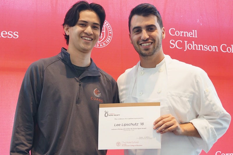 Photo of Michael and Lee holding a certificate