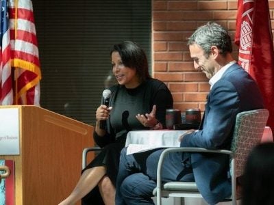 Angela and Drew on stage at the JWiB symposium