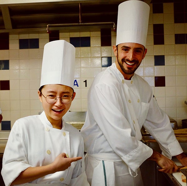 Photo of Nathan and a classmate wearing chef
