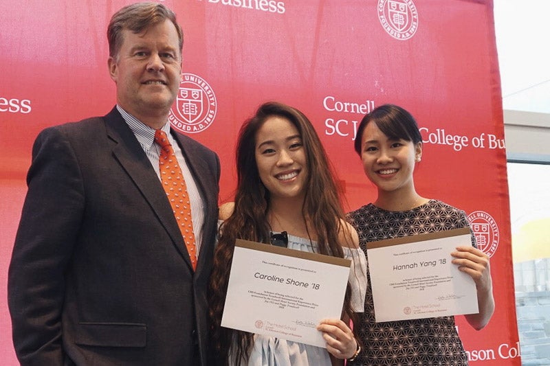 Photo of Phil with Caroline and Hannah holding certificates