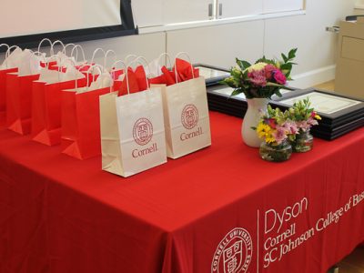Table of gift bags and framed awards