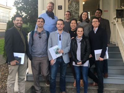 Photo of students standing outside on a staircase