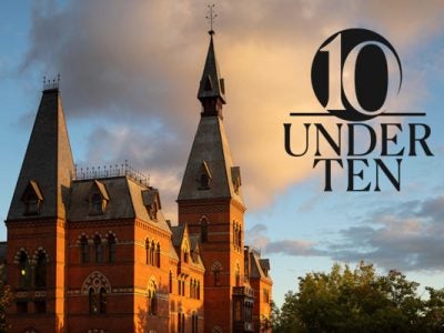 photo of Sage Hall, home of the Johnson Graduate School of Management, with sun shining on the bricks and blue sky and dramatic clouds in the background, overlaid with a "10 Under 10" graphic identifier.