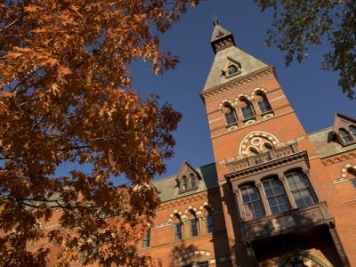 Sage Hall with autumn leaves and blue skies