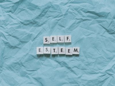 the words self esteem unwrapped in paper