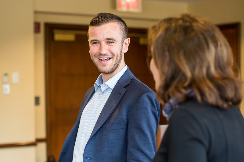 Photo of Alex Levy talking to Dean Walsh
