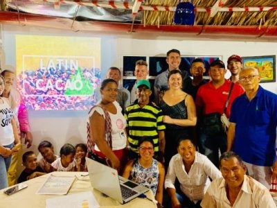 SMART team and children in a Colombian office