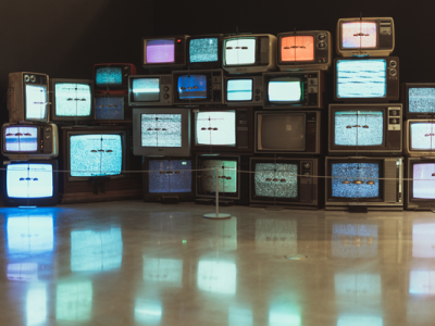 rows of televisions showing static