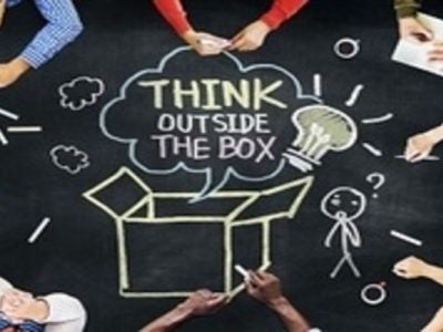 Chalk drawing that says "Think Outside the Box"