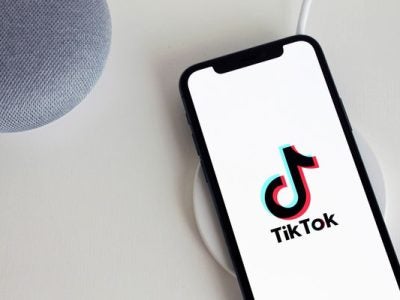 Photo of smartphone with the TikTok app logo on its screen