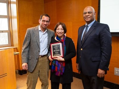 Photo of Lele with her son, Abhijeet, MBA ’89, and Ralph Christy, professor and director of Cornell’s International Institute for Food, Agriculture, and Development.
