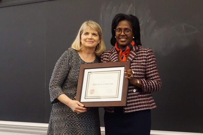 Photo of Deb and Lynn holding a certificate