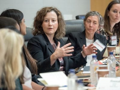 Photo of women sitting around a table