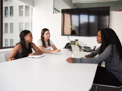 Business women meeting at a boardroom table