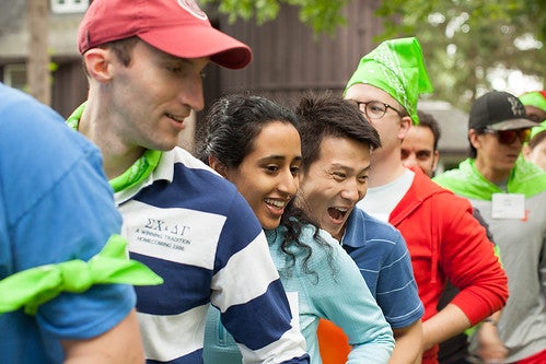 A group of Cornell MBA students excitedly participates in outdoor recreational activities as part of the Johnson Outdoor Experience (J.O.E.)