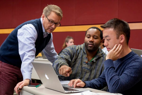 Professor Rob Kwortnik teaches students at a lecture hall in the Nolan School's Statler Hall