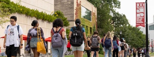 students walking near Statler Hall on Feeney Way