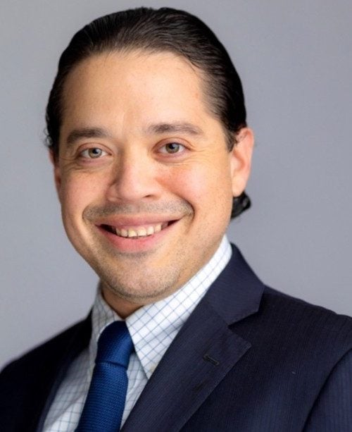 Headshot of J. Alex Albarracin.