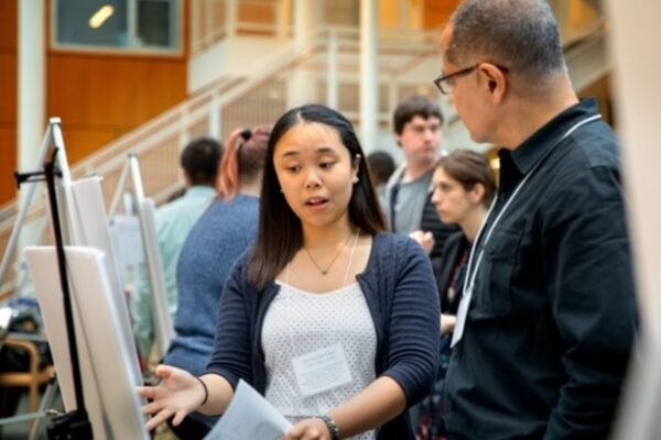 A student presenting to a partner.