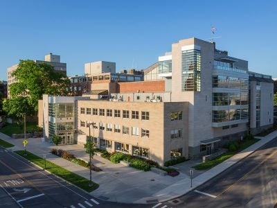The outside of Statler Hall on a sunny day.