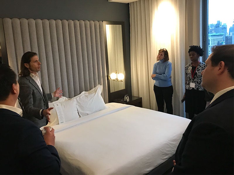 Students in a hotel room during a career trek tour to NYC.