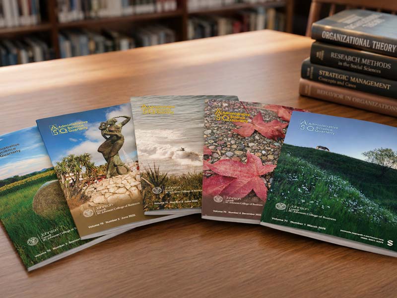 Administrative science quarterly publications on a table