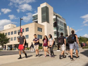 Students walking outside around campus.