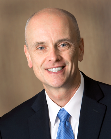 Headshot of Alexander Travis.