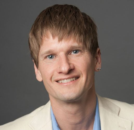 Headshot of Erik Simanis.
